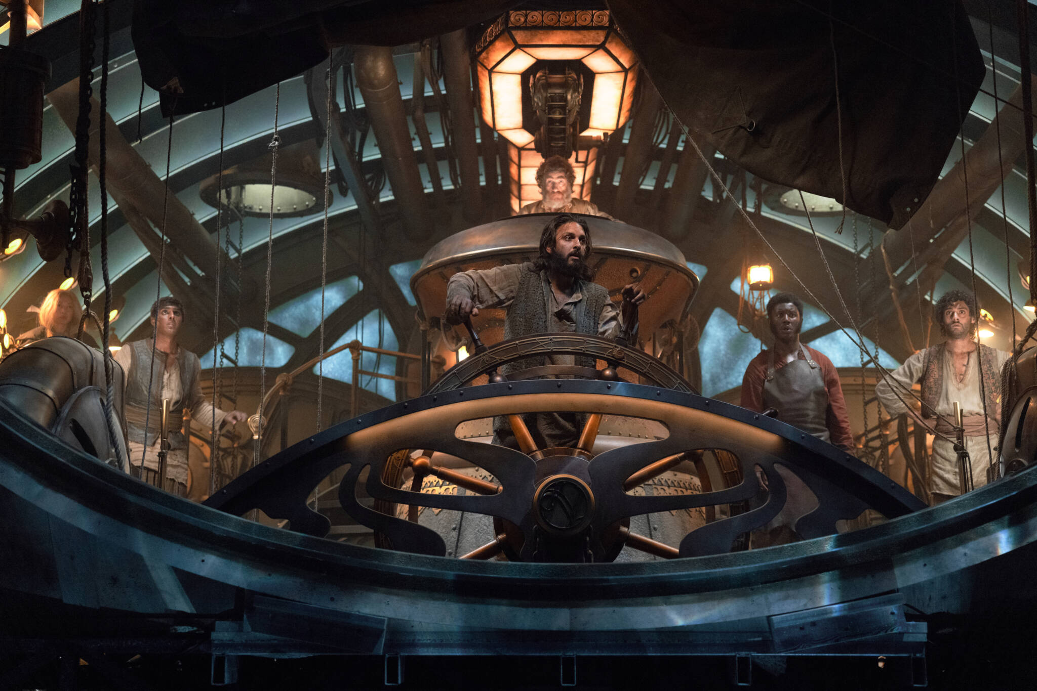 Nautilus/Series 1. (L to R) Ling Cooper Tang as Suyin, Ashan Kumar as Ranbir, Shazad Latif as Captain Nemo, Thierry Fremont as Gustave Benoit, Pacharo Mzembe as Boniface, Arlo Green as Turan in Nautilus.  Cr. Vince Valitutti/Disney+ © 2022.